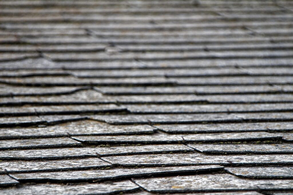 Broken shingles on an old roof 
