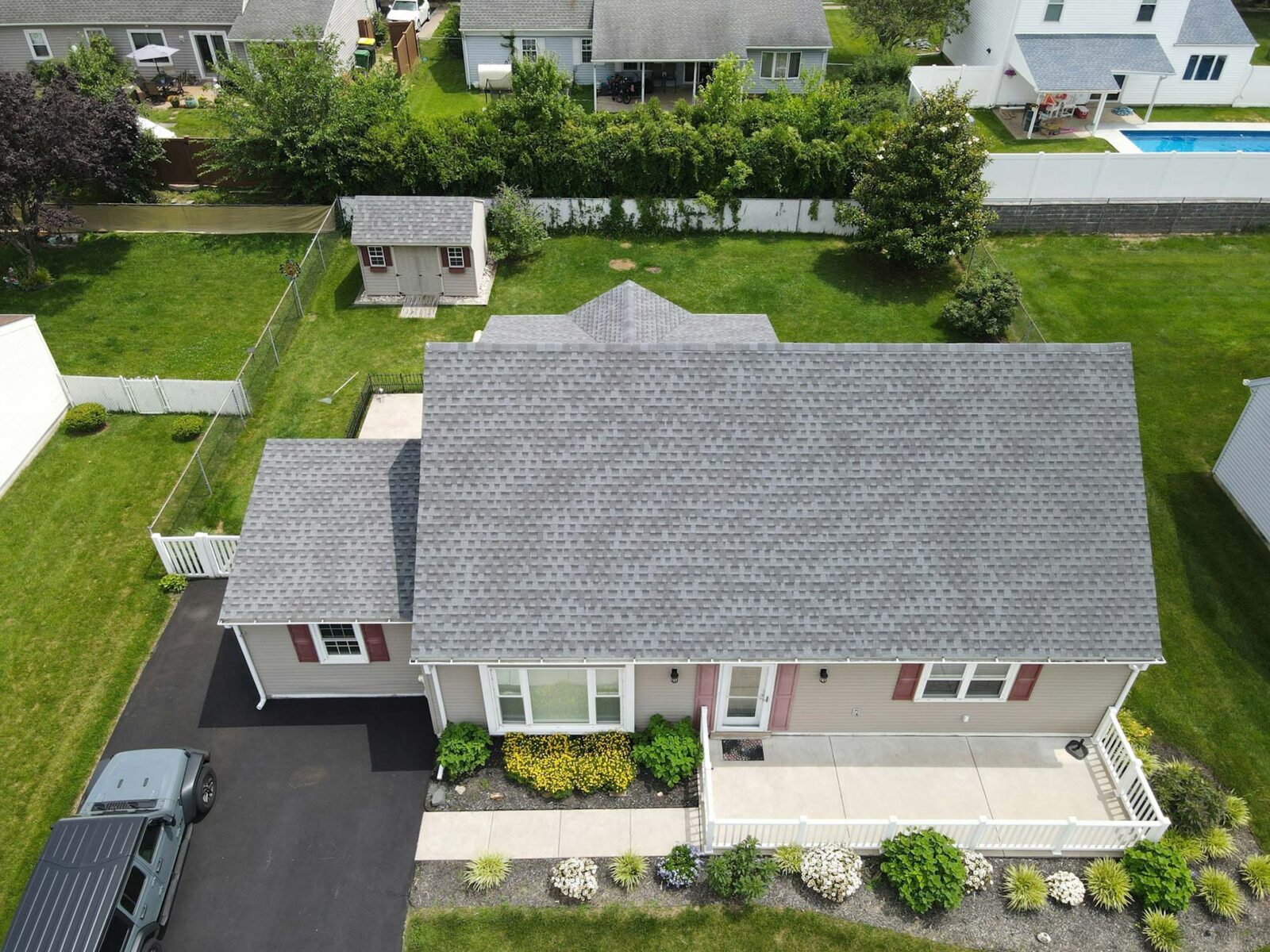 A residential property with a grey shingles roof