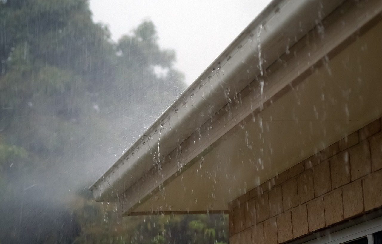 A residential roof during a heavy storm
