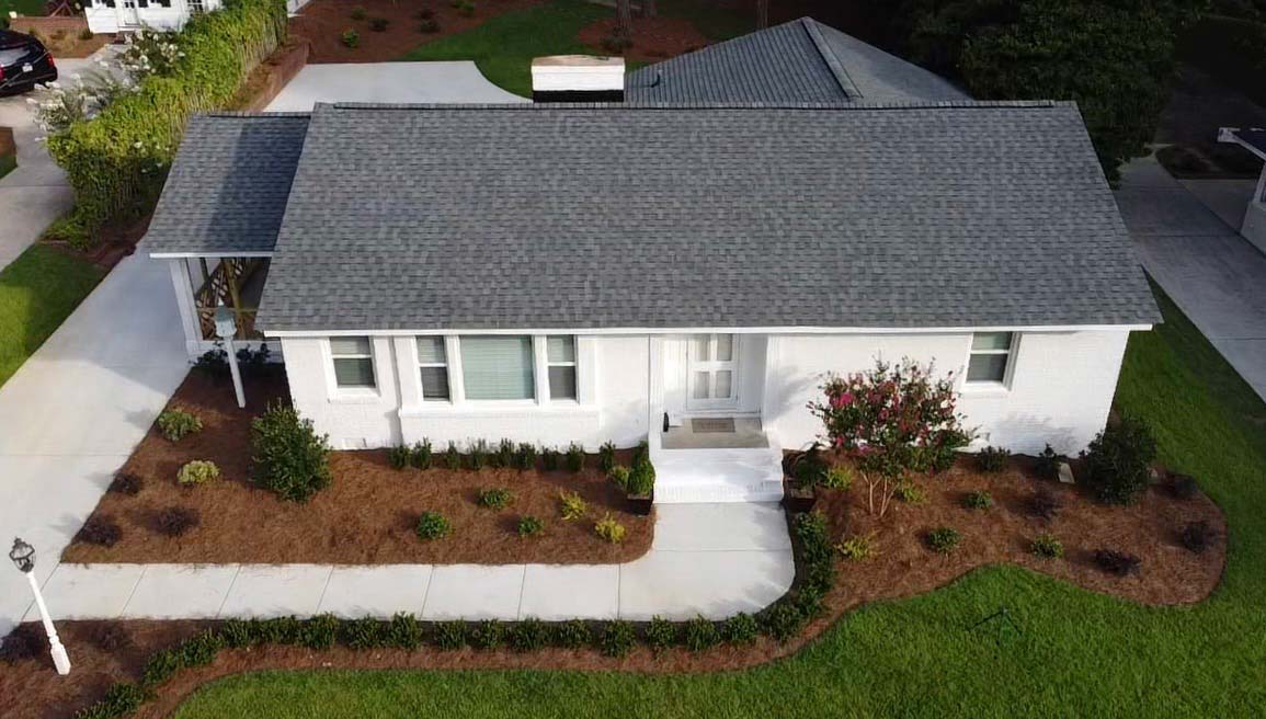 a white house with a new roof