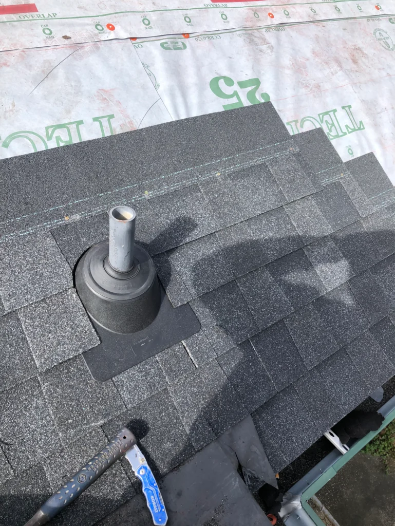 Shingles being installed with underlayment underneath