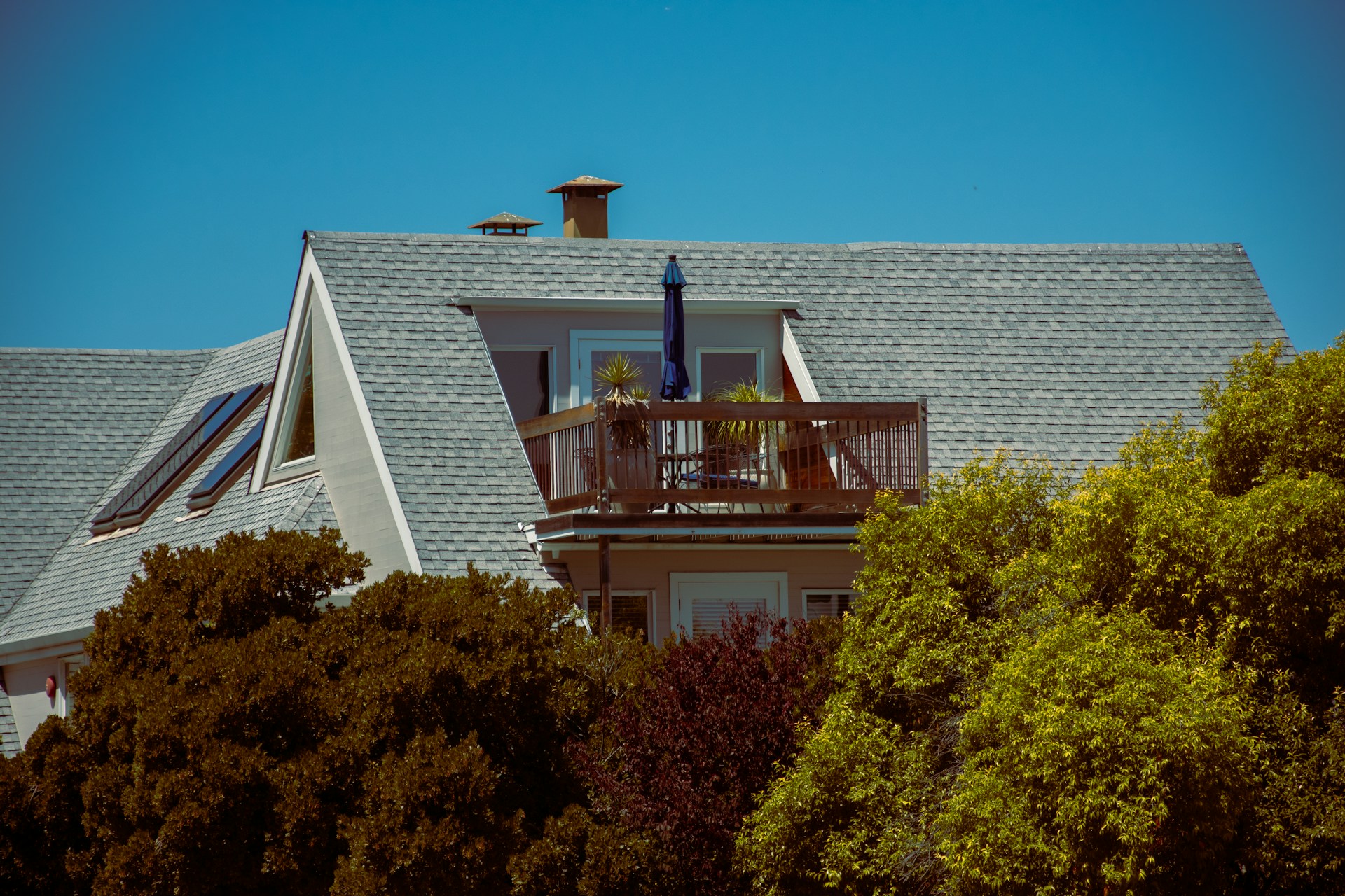 A home with a gray asphalt shingle roof